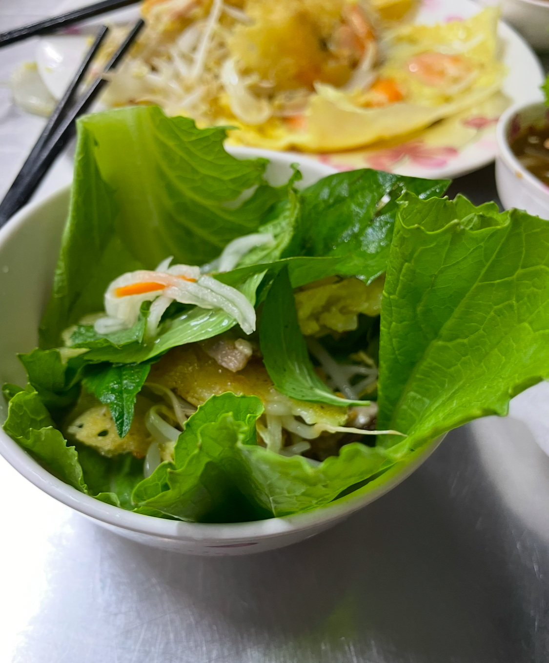 Bahn Rio- crispy pancake wrapped in lettuce with herbs at Banh Xio 46A in Ho Chi Minh City